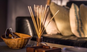 incense sticks in jar on coffee table in living room