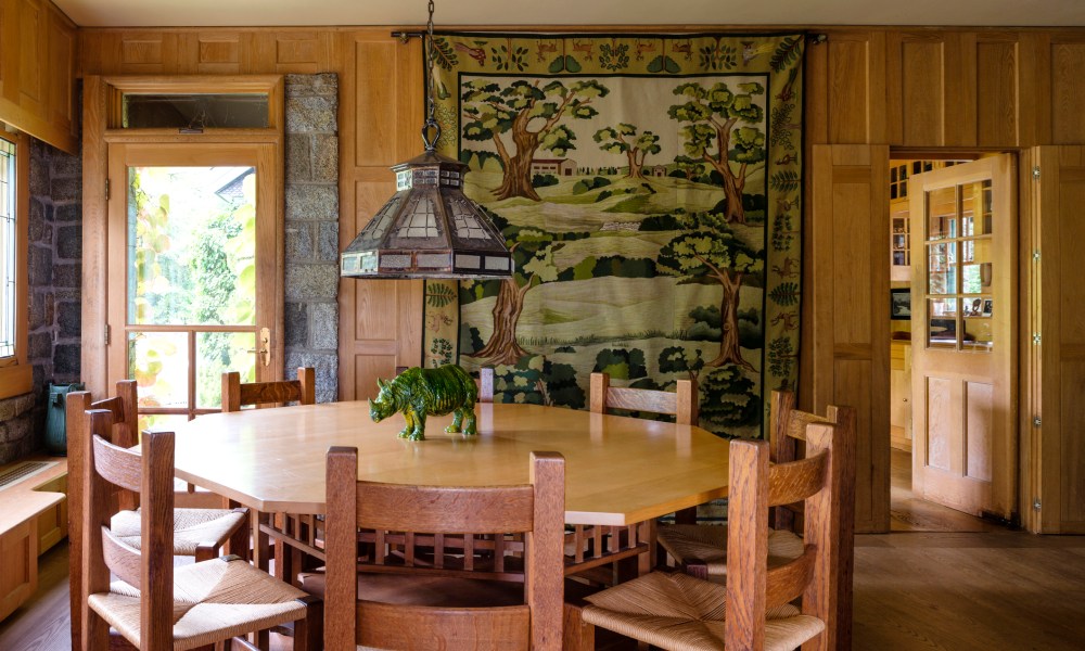 forest tapestry quilt on dining room wall