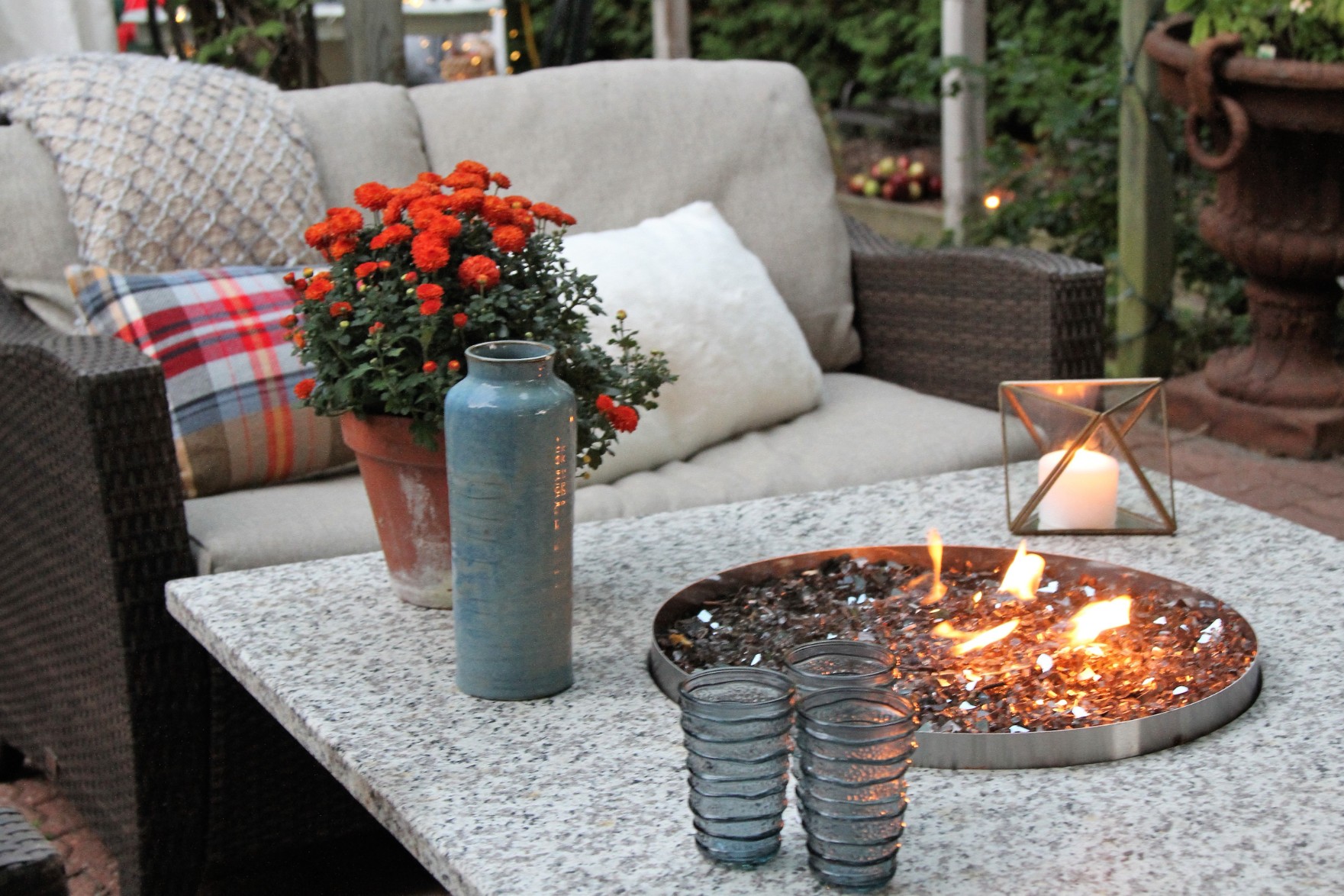 Patio with table, fire pit, and padded chair,
