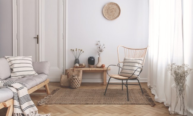 Small living room with wicker furniture and light colors