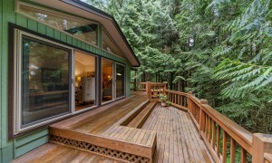 Deck with railing overlooking woods