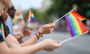 Crowd waving Pride flags