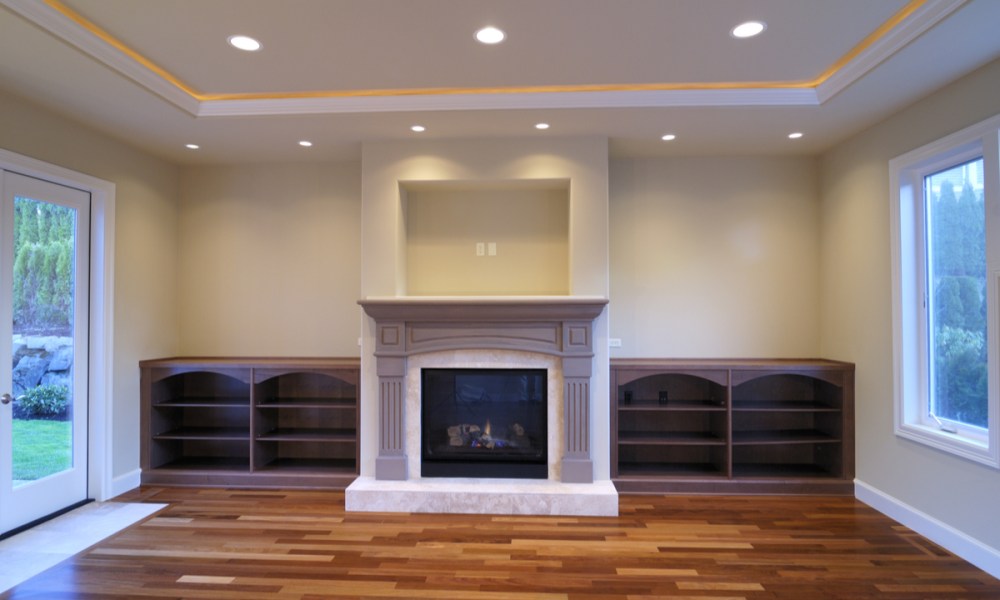 Recessed lights above a fireplace