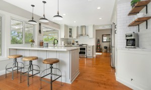 Modern farmhouse kitchen with bright hardwood floors