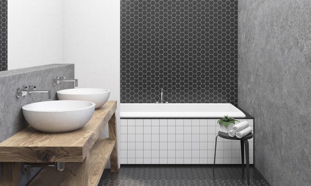 black and white bathroom with hexagon tile and concrete