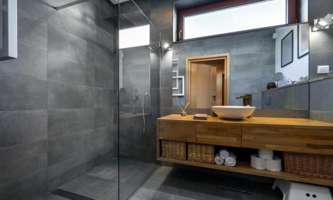 Modern bathroom with dark gray tiled shower