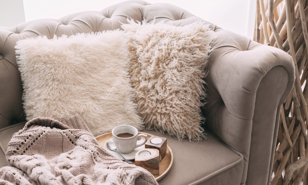 Cozy couch with light-colors and faux fur texture