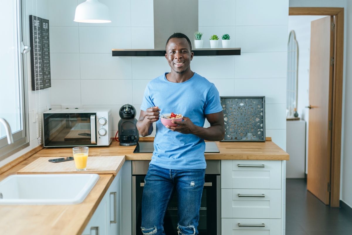 kitchen color ideas man eating blue walls