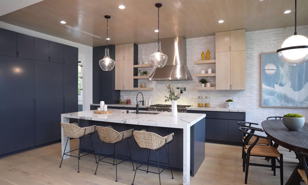 Blue and white kitchen with modern lighting