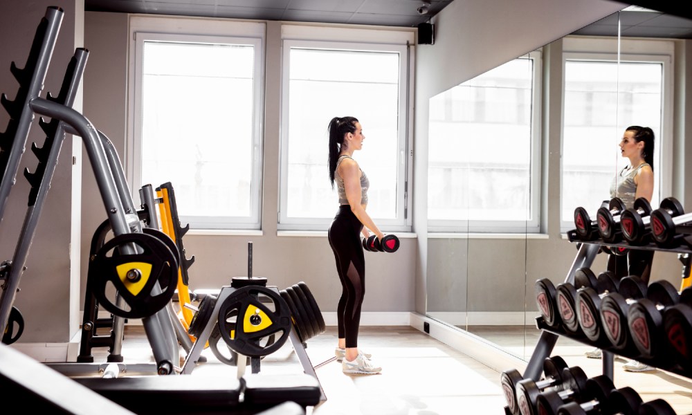 Woman working out in home gym.