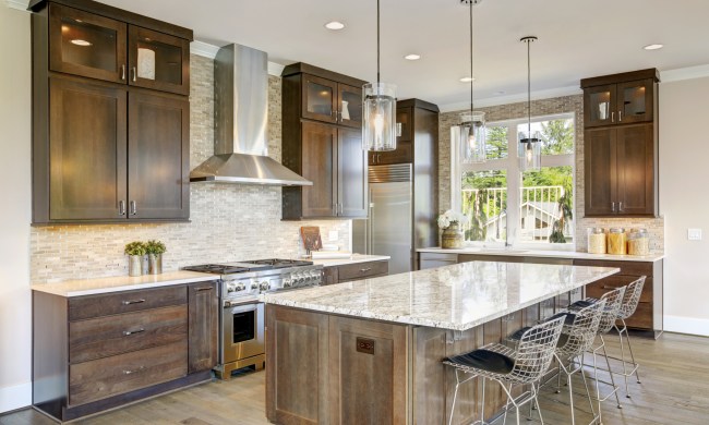 High ceiling kitchen with backsplash and wood cabinets