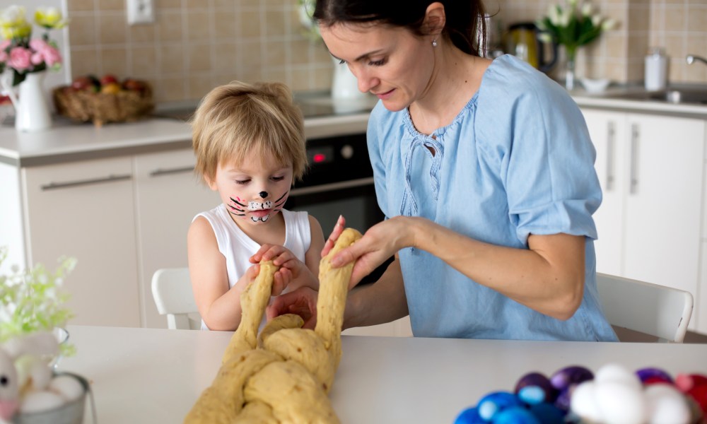 Mother and child making bread.