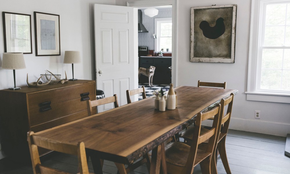 Rustic farmhouse dining room with a dog