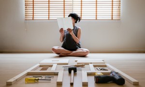 Woman reading furniture instructions