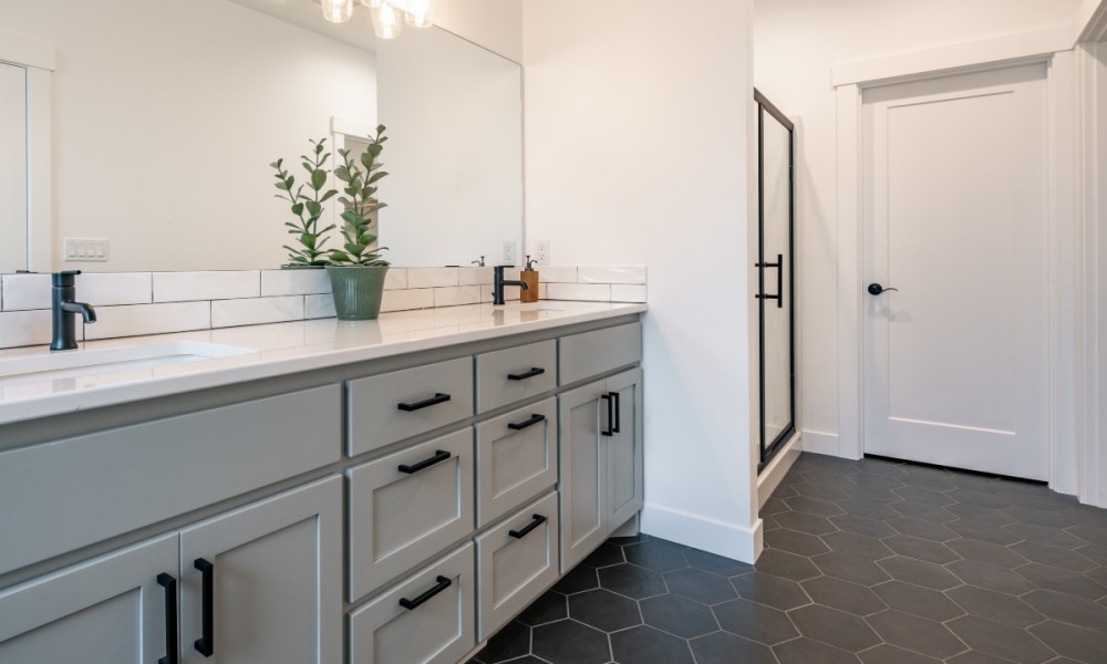 modern farmhouse bathroom with dark hexagonal tiles