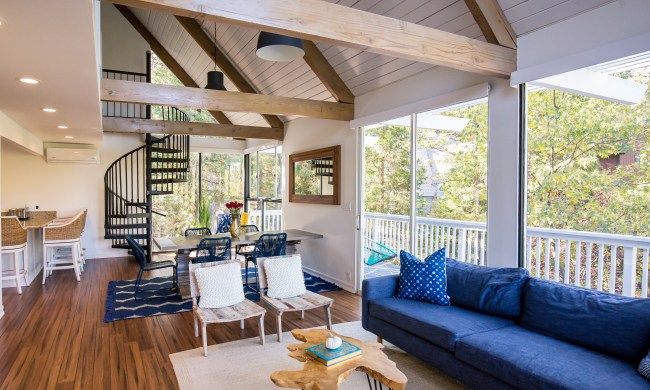 Modern farmhouse living room with a blue sofa