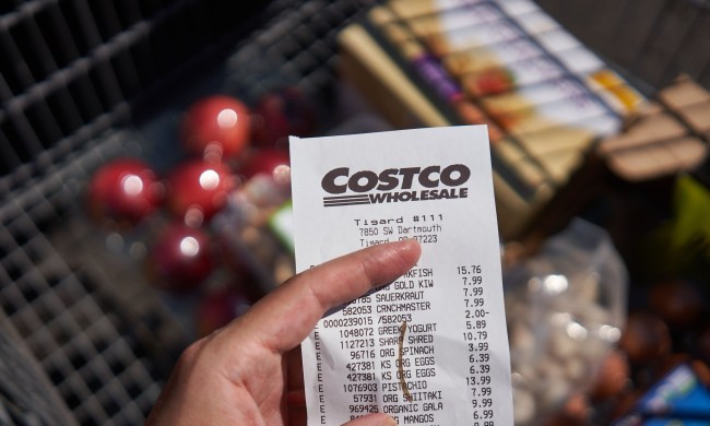 person holding costco receipt