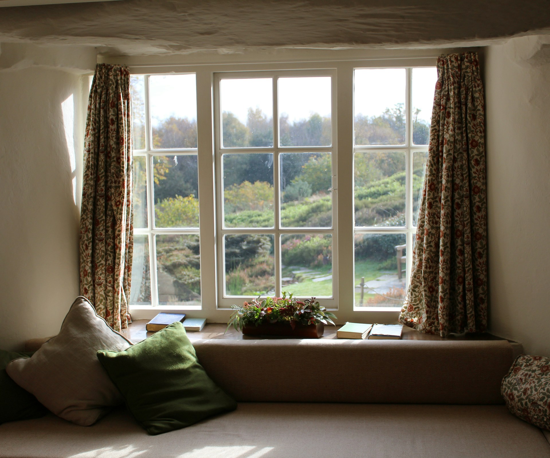 Window seat with curtains around it