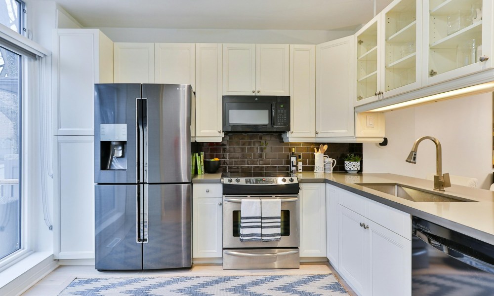 Chrome refrigerator with ice maker in a modern kitchen